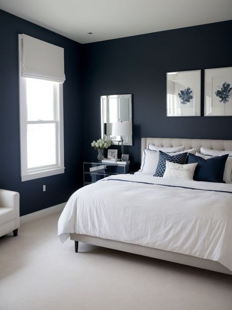 Create a stylish and modern bedroom with a navy accent wall as the focal point. Pair it with a sleek white bed frame and a mirrored dresser for a chic and sophisticated look. One Blue Wall Bedroom, Bedroom With Blue Carpet, Navy Blue White And Grey Bedroom, Navy Walls Bedroom, White And Navy Bedroom, Granny Bedroom, Navy Accent Wall Bedroom, Navy And White Bedroom, Navy Accent Wall