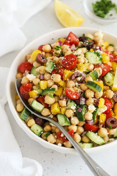 This easy Mediterranean Chickpea Salad combines colorful fresh veggies and a simple vinaigrette for a delicious, healthy side dish. We love using this Greek chickpea salad for meal prep lunches, paired with some grilled chicken or salmon for extra protein. This no lettuce salad doesn't get soggy and packs beautifully for work lunches, but also makes a delicious, fresh bbq side dish in the summer. Naturally gluten-free & vegan-friendly, it's great for a crowd! No Lettuce Salad, Meal Prep Lunches, Bbq Side Dish, Greek Chickpea Salad, Lettuce Salad Recipes, Mediterranean Chickpea, Vegan Greek, Greek Chickpeas, Mediterranean Chickpea Salad