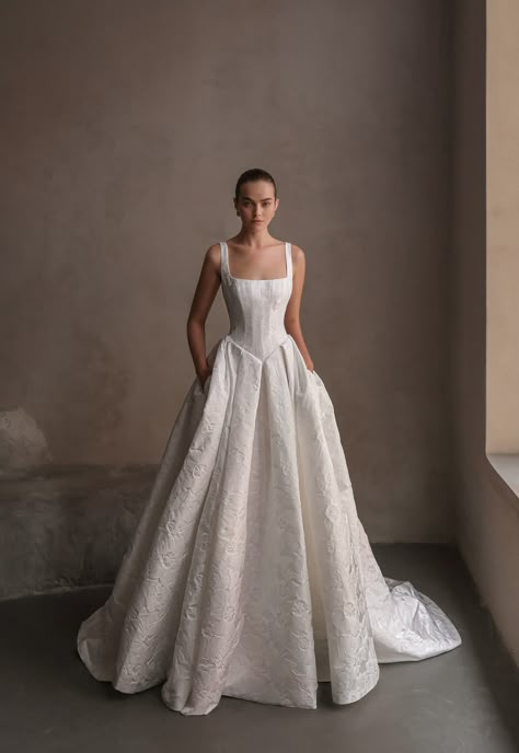 The TULIP wedding gown. A square neck gown made of floral mikado from bodice to train detailed with an accentuated back, buttons and basque waist. #NetaDover #CoutureBridal #ModernBridal #ModernBride #BridalDress #BridalCouture Venice Wedding Dress, Wedding Dress With Big Skirt, Jacquard Wedding Gown, Wedding Gown Square Neck, Classic Ball Gown, Classic Fall Wedding Dress, Basket Waist Wedding Dress, A&be Bridal, Tafetta Wedding Dress