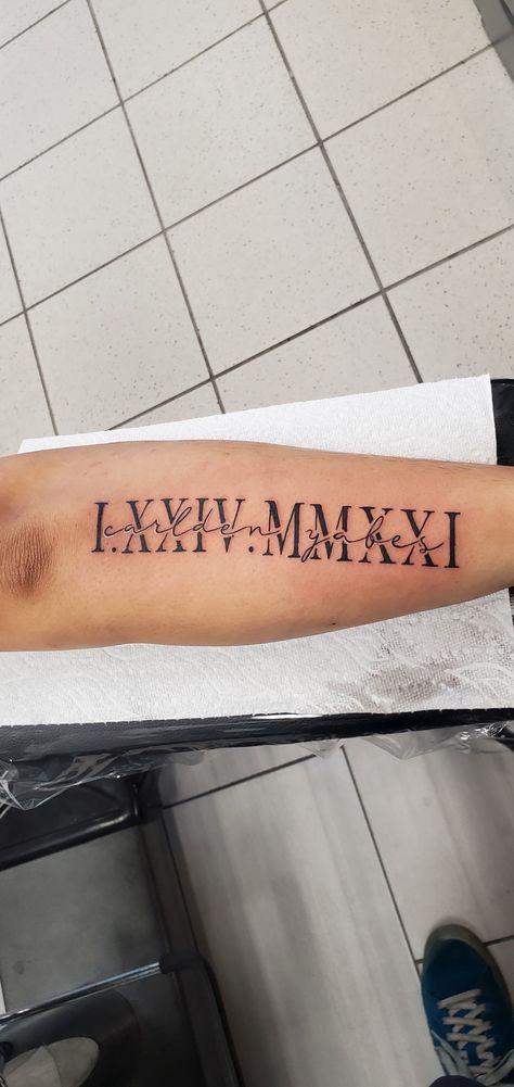 Name And Date Of Birth Tattoos, Name Tattoos For Son, Son Name Tattoo, Name And Date Tattoo, Name Arm Tattoo, Birth Date Tattoo Ideas, Sons Name Tattoos, Nails After Acrylics, Roman Numeral Tattoos