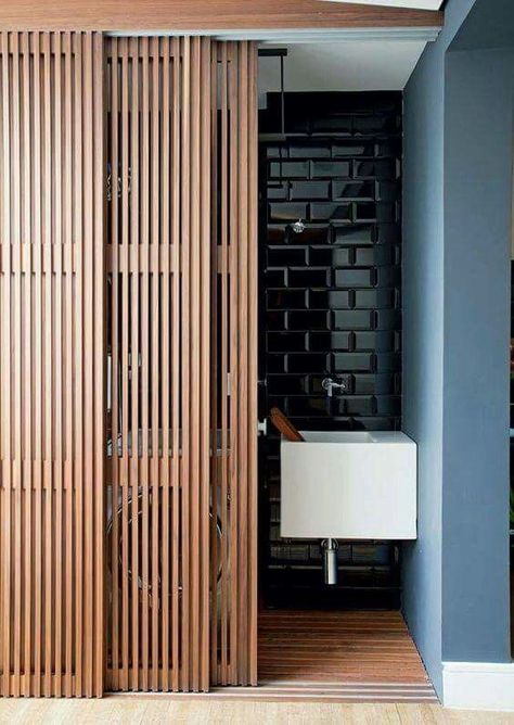 Sliding wooden doors for space-saving bathroom design Panelling Hallway, Ikea Hallway, Sliding Door Design, Interior Design Per La Casa, Upstairs Hallway, Ideas Ikea, Room Partition, Hallway Ideas Entrance Narrow, Studio Apartment Decorating