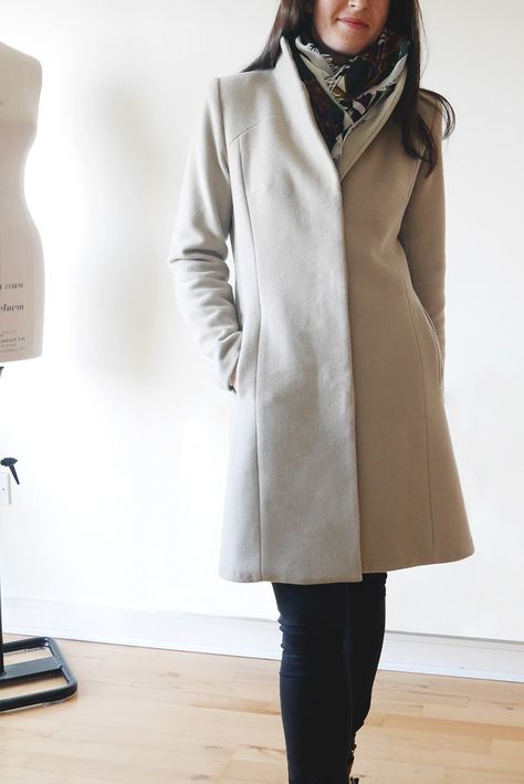 Female wearing beige wool coat with invisible button placket and standing collar fashion shoot Trench Coat Pattern, Boiled Wool Coat, Shawl Collar Coat, Stand Collar Coat, Coat Pattern Sewing, Pattern Hack, Wool Winter Coat, Butterick Pattern, Handmade Wardrobe