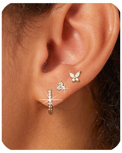 PRICES MAY VARY. [Lightweight Gold Earrings Set]: 3 pairs Dainty gold hoop earrings for women, include one pair of small hoop earrings, one pair of tiny tri - diamond gold stud earrings, and one pair of butterfly cubic zirconia earrings studs, a perfect blend of chic gold hoops and delicate studs. Enjoy all-day comfort, forgetting they're even on your ears. [Materials]: Hypoallergenic earrings for women, our gold huggie hoop earrings and gold studs are crafted with nickel-free, lead-free, and en Three Piece Earring Set, Cartlidge Earring Ideas, Piercing Stacks, Cartlidge Earrings, Dr Accessories, Gold Earrings Set, Earrings Cartilage, Double Piercing, Small Gold Hoop Earrings