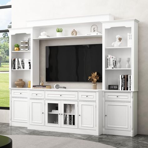 PRICES MAY VARY. Dimensions: The TV console: 57.2”W x 17.4”D x 30.5”H, the wall mounted bookshelf on the top: 69.1”W x 10.7”D x 8.7”H, the bookcase: 23.5”W x 10”D x 77.2”H, overall dimensions of the entire unit: 104.3”W x 17.4”D x 77.2”H-82.3”H, all of the dimensions are adjustable. NOTE: The entire unit will come in 3 boxes separately. Modern Design: This ECACAD white TV stand unit with glass doors is minimalist, the entire wall unit with carved legs will create luxury charm. It works well in l Tv Stand With Bookshelves, Entertainment Center Wall, Wall Units With Fireplace, Tv Stand With Glass Doors, White Tv Cabinet, Old Entertainment Centers, Tv Stand Bookshelf, Media Wall Unit, Bookshelves With Tv