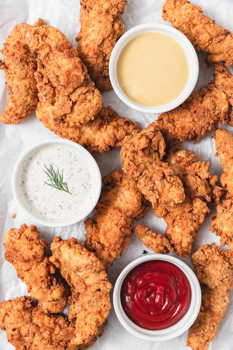 These buttermilk fried chicken tenders are super crispy and crunchy on the outside while still being juicy and tender on the inside. The buttermilk marinade and seasoned breading help you achieve the most flavorful fried tenders at home! I've also included the recipe for my easy, homemade buttermilk ranch but you can serve these tenders with your favorite dipping sauce. Homemade Chicken Marinade, Buttermilk Fried Chicken Tenders, Buttermilk Marinade, Homemade Buttermilk Ranch, Buttermilk Chicken Tenders, Breaded Chicken Tenders, Homemade Chicken Nuggets, Fried Chicken Tenders, Crispy Chicken Tenders