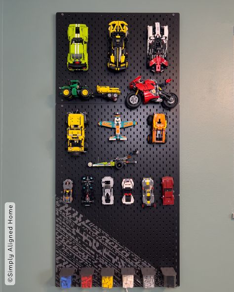 Say goodbye to LEGO chaos and hello to organized bliss! Learn how to transform an IKEA pegboard into a sleek LEGO storage solution. Elevate your play area and unleash your building passion effortlessly! Lego Storage Wall Ideas, Pegboard Lego Storage, Ikea Peg Board Kids, Ikea Skadis Lego, Ikea Pegboard Organization, Wall Lego Storage, Playroom Lego Display, Lego Build Station, Ikea Pegboard Boys Room