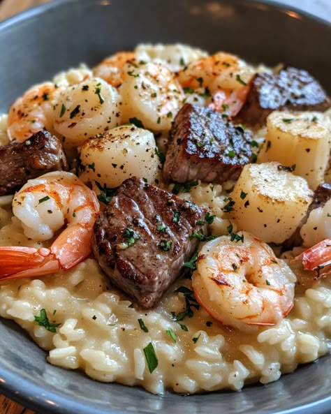 Seafood and Steak Risotto is a luxurious surf-and-turf delight that combines tender steak and fresh seafood with creamy, flavorful risotto. This dish brings the best of both worlds onto one plate, perfect for a special dinner or whenever you feel like indulging. It’s a gourmet meal that’s surprisingly simple to prepare! Surf And Turf Risotto, Risotto Recipes Steak, Valentines Dinner Seafood, Surf And Turf Recipes Scallops, Risotto And Steak, Surf And Turf Valentines Dinner, Steak And Crab Meat Recipes, Easy Surf And Turf Recipes, Shrimp Steak Recipes