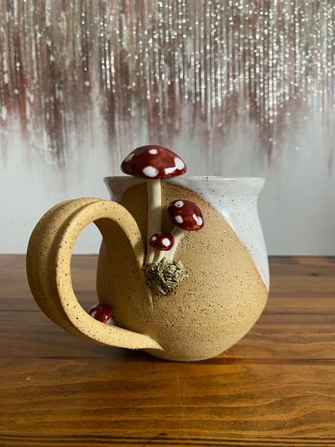 Each unique mug is thrown, trimmed, carved, and glazed by hand. All mugs are dishwasher and microwave safe. Diy Clay Tea Cup, Mushroom Pinch Pot Ceramics, Leaf Mug, Cute Ceramic Cups, Mug Clay Ideas, Pottery Tumbler, Pottery Mug Glaze Ideas, Tree Mug, Cermaic Mugs