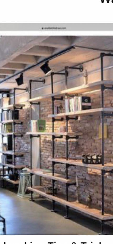 Black White And Tan Basement, Industrial Display Shelves, Living Room Designs Lighting, Industrial Wall Design, Industrial Showroom, Industrial Kitchen Ideas, درج السلم, Pipe Desk, Industrial Pipe Shelves