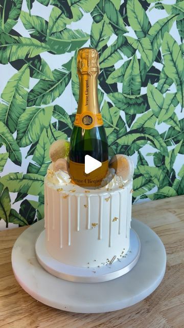 Reva Alexander - MerciCakes on Instagram: "Want an easy way to make an impression on your guest? Include a bottle service💕 (if you are making for a client they have to provide the bottle of alcohol unless you have your own liquor license)🤷‍♀️   #birthdaycake #showercake #aniversarycake #bottleservicecake #itsreva #lakeoconeecakes #reynoldslakeoconee  #cakedecorating" Cakes With Wine Bottles On Top, Champagne Cake Design, Liquor Cake For Men, Champagne Bottle Cake, Cake With Alcohol Bottles On Top, Liquor Bottle Cake, Alcohol Bottle Cake, Cake With Champagne Bottle, Cake With Wine Bottle