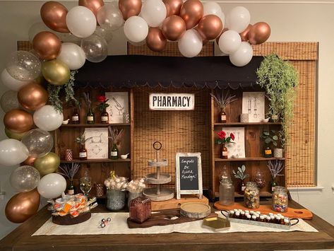 After searching for vintage Pharmacy/Apothecary themed decor for a party, I decided to come up with my own! Everything on this dessert table was built from scrap wood and designed to look like an apothecary storefront. Enjoy! #graduation #party #desserttable #apothecary #pharmacy #custom #decor #theme #dessert #desserts Pharm D Graduation Party, Apothecary Theme Party, Pharmacy Grad Party, Pharmacy Tech Graduation Party Ideas, Pharmacist Retirement Party, Pharmacy Party Decorations, Pharmacy Graduation Party Decorations, Pharmacy Week Decorations, Pharmacy Graduation Party Ideas