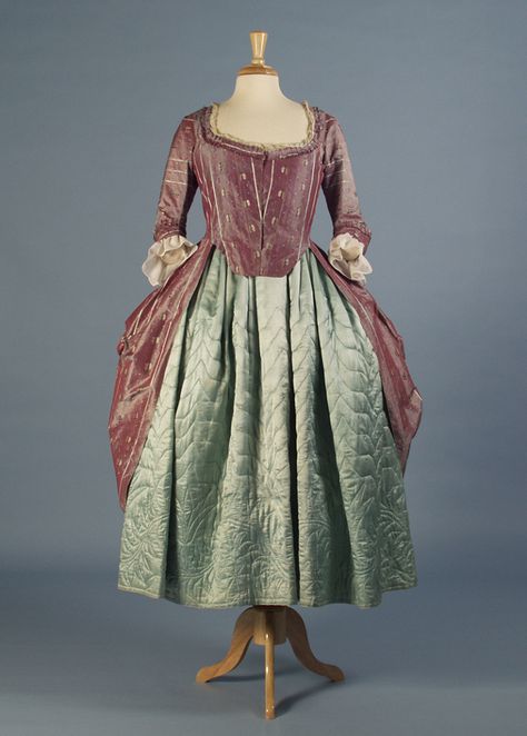 1. Robe à l’anglaise European, 1770s Iridescent purple silk with brocaded flowers, lined with linen, silk hem facing, linen tapes Gift of Ross Trump in memory of his mother, Helen Watts Trump, KSUM 1995.68.1  2. Blue satin quilted petticoat European, ca. 1750-75 Blue silk satin, wool lining, woolen batting, linen waistband Silverman/Rodgers Collection, KSUM 1983.1.3 1750s Fashion, Quilted Petticoat, 1770s Fashion, 1780s Fashion, 18th Century Womens Fashion, 18th Century Dresses, 1700 Fashion, 18th Century Women, 18th Century Dress