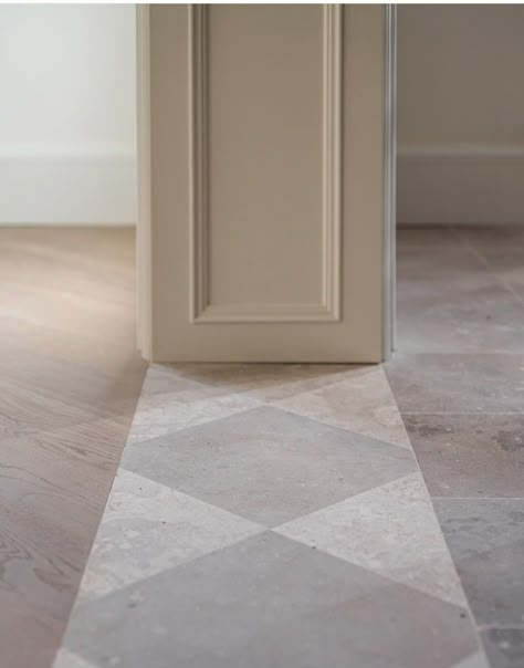 Marble Tile Foyer Entryway, Corridor Tile Pattern Floor Design, Marble Floor Transition, Tile Foyer With Wood Floors, White Tile Entryway, Herringbone Wood Floor Bathroom, Tile To Tile Transition Ideas, Tile Floor With Border, Large Format Tile Floor