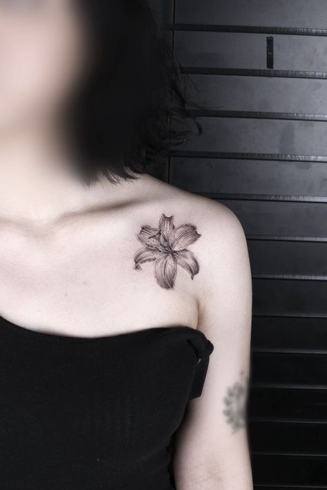 250+ Lily Tattoo Designs With Meanings (2020) Flower ideas & Symbols Black Lillies Tattoo, Lily's Tattoo, Black Lily Tattoo, Lily Shoulder Tattoo, Lilly Tattoos, Lily Tattoo Designs, Shoulder Tattoos For Females, Stargazer Lily Tattoo, Lilly Flower Tattoo