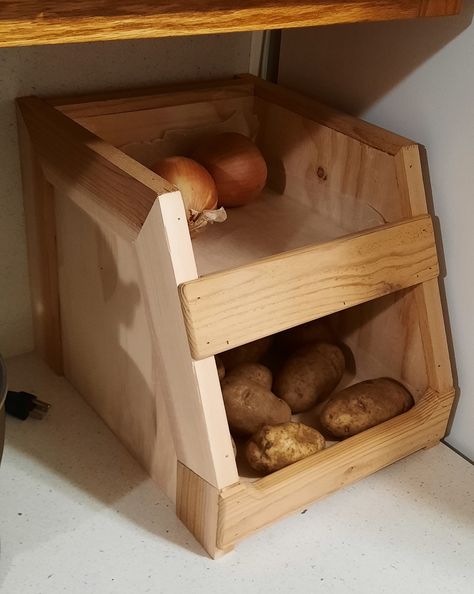 Convenient handmade fruit and vegetable storage box. This box features an open design for easy access, and looks great on the counter top or pantry shelf. If storing potatoes as shown, it is best to keep them in a dark environment. Made from quality plywood with Cedar trim, it is a solid and handsome piece. As shown and advertised, this box does not have any finish on the wood. I will be offering other wood choices in the very near future, as well as enclosed designs. Storing Potatoes, Potato Box, Vegetable Boxes, How To Store Potatoes, Dark Environment, Fruit And Vegetable Storage, Brad Nails, Vegetable Storage, Pantry Shelf