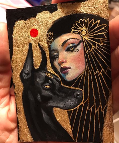 Jel Ena 👑 on Instagram: “Day 6 #black dog #anubis 🐺 Available on my store, link in bio. 2.5 x 3.5 in. Oil on paper, framed. #mabsdrawlloweenclub . . . .…” Egyptian Goddess Painting, Cleopatra Painting Egyptian Art, Jel Ena Art, Cleopatra Drawing, Egyptian Art Drawing, Pharaonic Art, Egypt Painting, Cleopatra Art, Egyptian Artwork