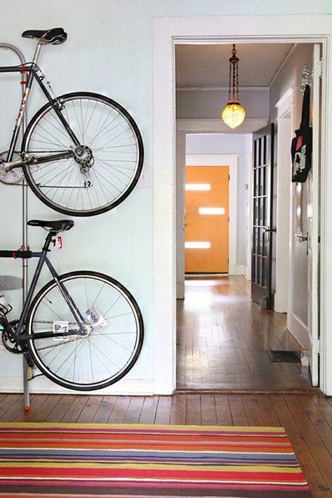 Bikes & Skis & Surfboards, Oh My: Ingenious Ways to Store Gear in a Small Space | Apartment Therapy Bike Storage Small Space, Bike Stand Diy, Bike Storage Apartment, Indoor Bike Rack, Bike Shelf, Bike Storage Solutions, Support Velo, Indoor Bike, Bike Stand