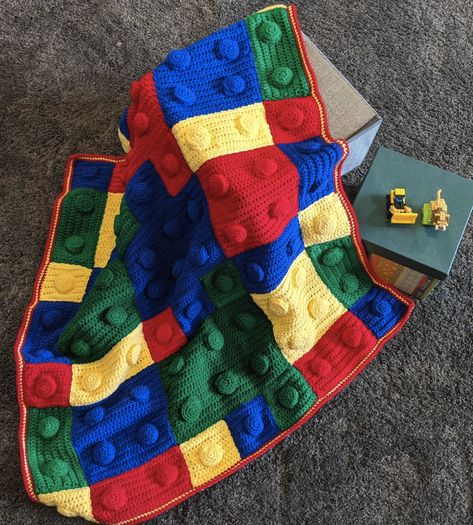 This really is a timeless piece, because who doesn't love legos? Easy to follow and comes out so impressive! #crochetblanket #crochetersoftheworld #crochettoy #crochetart #crochet #crochetaddict #crochetlove #crocheting #crochetinspiration #crochetaddicted #amigurumiaddict #amigurumilove #amigurumi #amigurumis #amigurumiaddict #crochetbabyblanket #legocrochet #legoblanket Lego Block Crochet Blanket, Lego Afghan Pattern Free, Lego Block Crochet Pattern, Crochet Lego Pillow, Lego Crochet Pattern Free, Crochet Lego Blanket Free Pattern, Crochet Lego Blanket, Lego Crochet, Lego Blanket