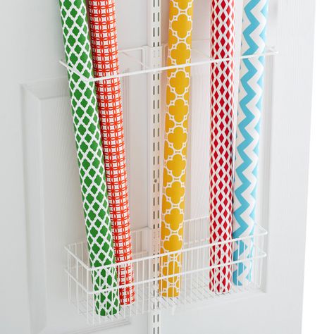 Our elfa utility Gift Wrap Rack, used in combination with our elfa utility Deep Basket, simply and beautifully organizes long rolls of gift wrap, posters, umbrellas and much more. It is an easy addition to one of our best selling collections, the elfa utility Door & Wall Rack.  Build your own customized solution with our <a href="/elfa/rackplanner/index.htm">elfa utility Door & Wall Rack Planner</a>. Budget Storage, Craft Closet Organization, Gift Wrap Organization, Wrapping Paper Storage, Gift Wrap Storage, Organizational Tips, Plastic Container Storage, Plastic Storage Bins, Wall Rack