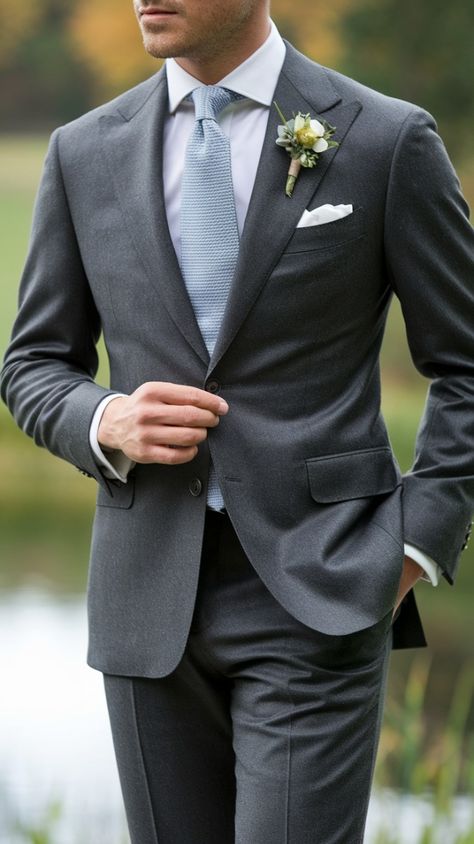 Keep warm and stylish during the colder months with our charcoal grey wool suit! Its refined fabric and tailored fit make it perfect for fall and winter occasions, while still maintaining a sleek and modern look. Add a patterned tie or scarf for a seasonal touch. 🍂🧣 #FallFashion #WoolSuit #CharcoalGreyStyle #WinterWardrobe #MensFashion Dark Grey Suit With Dusty Blue Tie, Black Suit Gray Tie, Groom Attire Charcoal Grey, Dark Gray Suit Wedding Groom Attire, Wedding Groom Suit Grey, Father Of The Bride Suit Grey, Charcoal Gray Tux Wedding, Charcoal Grey Wedding Theme, Charcoal Gray Wedding Suit