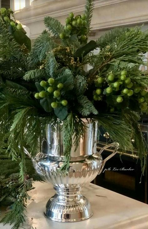 Champagne Bucket Christmas Decor, Holiday Greenery Centerpiece, Champagne Bucket Flower Arrangement, Silver Pitcher Decor Ideas, Tall Christmas Vase Arrangement, Silver Vase With Flowers, Holiday Greenery Arrangements, Holiday Floral Arrangements Christmas, Champagne Bucket Decor