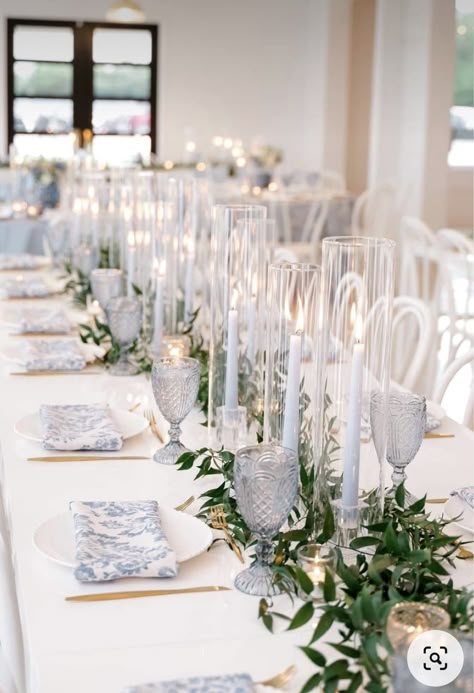 Blue Candles Wedding Table, Blue And White Candle Centerpiece, Coastal Candle Centerpieces, Clear Glass Wedding Table Decor, Blue And White Candle Centerpieces, Wedding Ideas White And Blue, Light Blue Greenery Wedding, Vintage Blue Table Setting, Light Blue Tablescape Wedding