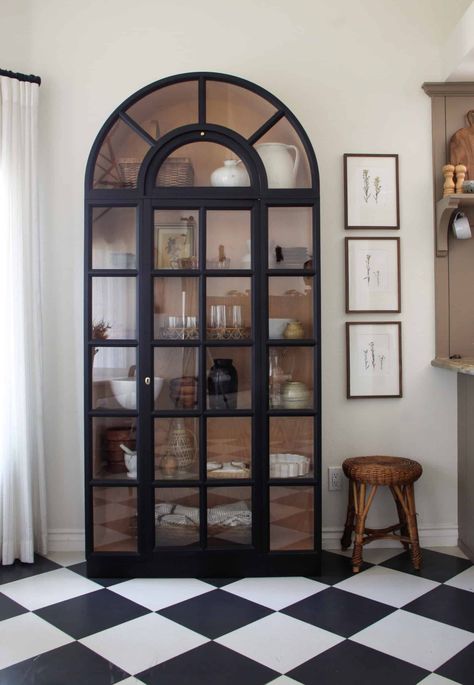 Tips to Find, Paint, and Style an Arched Display Cabinet — Your Site Title Painting Cabinets Kitchen, Black Arched Cabinet, Arched Display Cabinet, Organization Cabinets, Arched Bookshelf, Harlequin Floors, Bedroom Dresser Styling, Wildflower Home, Foyer Cabinet