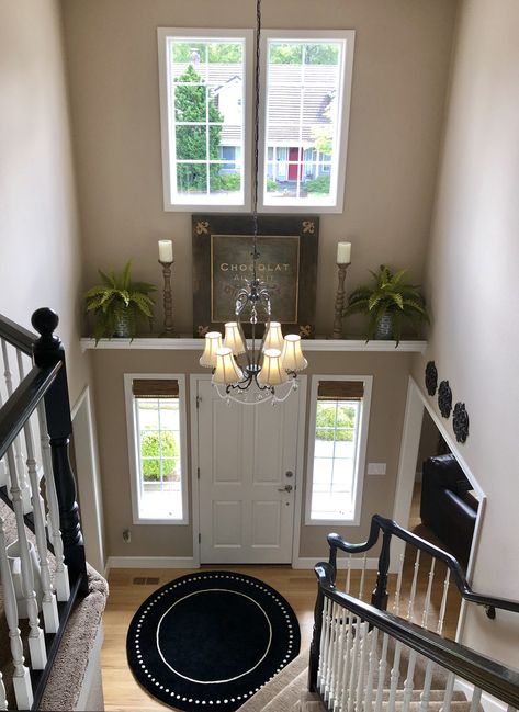 French decor Above Front Door Decor Interior Entryway, Bottom Of Stairs Corner Decor, Ledge Above Front Door, Stair Ledge Decor, Staircase Niche, Above The Door Decor, Entryway Ideas With Stairs Entry Foyer, Entryway Ledge, Foyer Ledge Decorating Ideas