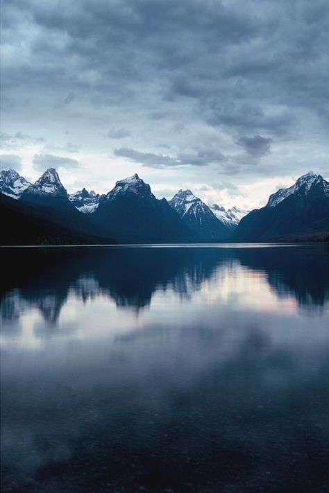 This gorgeously eery shot of Glacier National Park, Montana gives us the goosebumps! (photo: Beth Spreadborough) Blue Ridge Parkway, Blue Ridge Mountains, Alam Yang Indah, Still Water, Pretty Places, Oh The Places Youll Go, Beautiful World, Pretty Pictures, Beautiful Landscapes