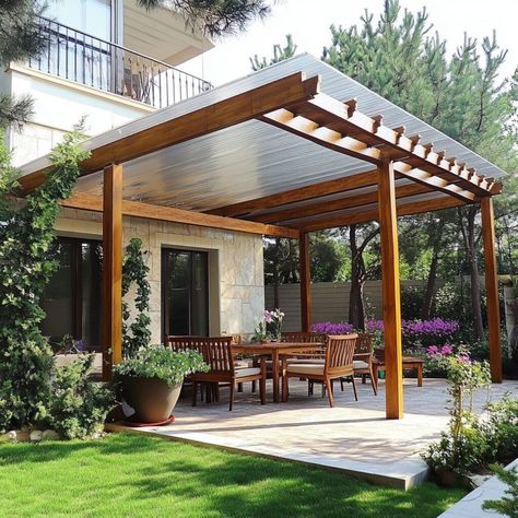 This elegant patio cover features a polycarbonate roof supported by a sturdy wooden frame, providing a perfect blend of style and functionality for outdoor living spaces. Polycarbonate is an ideal building material, offering UV protection, impact resistance, and light diffusion, making it perfect for shaded areas like patios and decks. Create a comfortable, weather-resistant outdoor retreat that enhances your home's beauty and extends your living space into nature. Clear Roof Patio, Polycarbonate Roof Design, Building Materials Architecture, Patios And Decks, Glass Porch, Polycarbonate Roof, Building And Construction, Porch Roof, Patio Cover