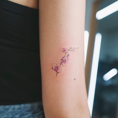 No photo description available. Purple Orchid Tattoo, Orchid Tattoo Meaning, Orchid Flower Tattoos, Tattoo Ear, Orchid Tattoo, Small Flower Tattoos, Dainty Tattoos, Tattoo Designs And Meanings, New Tattoo