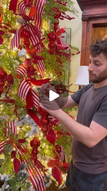 John Mark Sharpe on Instagram: "A little tree inspiration ✨❤️🥰" Candy Cane Ribbon Christmas Tree, Santa Themed Tree, How To Make Your Christmas Tree Full, Ribbon Placement On Christmas Tree, Bow On Top Of Christmas Tree, Mesh On Christmas Tree Ideas, Cardinal Christmas Tree Ideas, Xmas Tree Ribbon Ideas, Red Christmas Tree Decorations Ideas