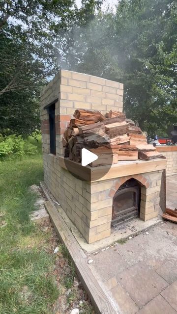 Kristin & Hank | Homesteading in PA on Instagram: "How we transformed our homestead with a DIY smoker! It all started when we stumbled upon a free wood stove, sparking the idea to integrate it into our outdoor kitchen setup. With a clear vision in mind, we strategically positioned the stove within our brick structure and began the meticulous process of fabrication.   The first challenge was to create a custom chimney that would efficiently channel smoke from the stove to the smoker box. Thanks to the skilled hands of our friends Andy, Nate, and Seth, who brought their professional welding expertise and tools, we were able to design and weld a durable chimney that seamlessly connected the stove to our newly constructed smoker box.  We surrounded the smoker with a layer of sturdy brick, ensu Diy Brick Bbq Grill And Smoker, Homemade Smoker How To Build, Bbq Smokers Build, Diy Outdoor Stove, Smoker Diy, Outdoor Kitchen Setup, Brick Smoker, Outdoor Wood Stove, Homesteading Garden