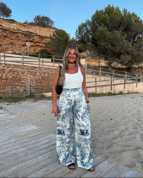 Holiday Inspo by Jenny 💙 How gorgeous!! Very limited pieces restocked in the Tiger Trousers & Shirts 🤍💙 Jenny is wearing size Medium . . . . #twopieceset #tigerprint #eveningoutfit #holidaystyling #toiledejouy Wide Leg Trousers | Shirt Styling | Ways to Wear Style | Styling Video Reel Inspo | Tiger Safari Print | Summer Holiday Fashion Outfit Inspo | OOTD Fashion | OOTN Evening Style | What to Wear | Minimalist Style | Chic Fashionista | Parisian Vibes | Tailored Toile De Jouy | Silver Leath... Printed Trousers Outfit, Summer Holiday Fashion, Evening Holiday Outfits, Holiday Style Summer, Shirt Styling, Holiday Inspo, Chic Fashionista, Evening Style, Parisian Vibes