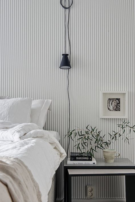 wallpaper is having a major comeback! Stripe Wallpaper Bedroom, Simple Nightstand, Night Stands, Style Deco, Gray Bedroom, Striped Wallpaper, Wallpaper Bedroom, Cheap Decor, White Bedroom