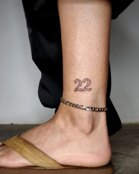 Number 22 Handpoked on the ankle in modified old English font. No machines used, all poked by hand. The number 22 is only an outline and done on the exterior of the left ankle. Leg Number Tattoo, Number 22 Tattoo, Old English Tattoo, 22 Tattoo, Number Tattoos, English Font, Number 22, Hand Poked Tattoo, Old English Font