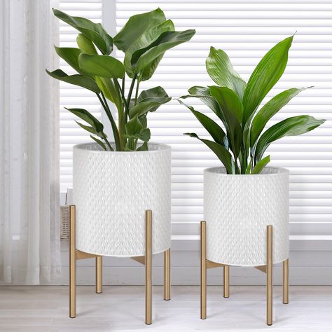 PRICES MAY VARY. Mid Century Planters: Featuring a sleek gold metal stand and white metal flower pot with geometric accents, these planters embody mid-century minimalism. Their timeless design makes them a perfect fit for any style of decor. Indoor/Outdoor Plant Pots: The plant pots are made of durable iron that will last for years, and the lightweight metal sturdy construction makes them easy to move and won't break like ceramic plant pots. The bottom drainage hole design, coupled with the remo Plant Decor Living Room, Best Bathroom Plants, Metallic Decor, Mid Century Planter, Indoor Flower Pots, Living Room Plants, Floor Plants, Bathroom Plants, White Planters