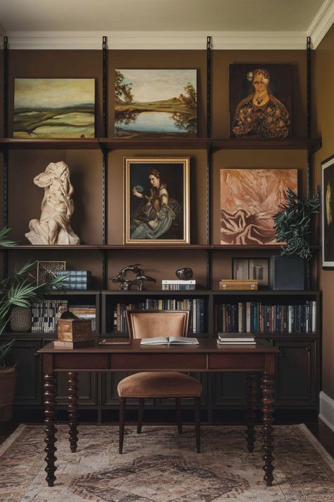 Decorate with paintings of classical sculptures, antique illustrations, or dramatic landscapes. 🕰️🖋️ Choose muted colors and vintage subjects to reflect the Dark Academia aesthetic. Add a gallery wall with botanical prints, portraits, or gothic-inspired pieces. Frame them in ornate or distressed frames to capture elegance. 📚 #DarkAcademiaLivingRoom #DarkAcademiaDesk #DarkAcademiaInteriorDesign #MoodyHomeOffice #DarkAcademiaAestheticOffice #DarkAcademiaHouseDecor #DarkAcademiaRoomInspiration Dark Academia House, Dark Academia Desk, Dark Academia Living Room, Dark Academia Office, Darkacademia Aesthetic, Dark Academia Home, Dark Academia Art, Academia Art, Haunting Beauty