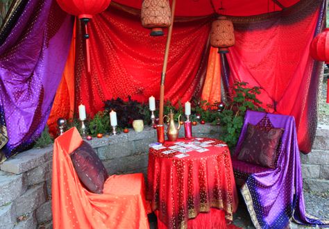 Turn a garden corner into a gypsy tent. Drape fabrics over furnishings and suspend some to make a canopy. Spiritual Room Ideas, Tarot Reading Room, Halloween Cubicle, Reading Tent, Vintage Fortune Teller, Magic In The Moonlight, The Fortune Teller, Fortune Telling Cards, Halloween Party Dinner