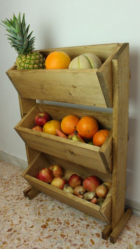 A rustic, market-style stand for storing fruit is a great addition to any kitchen. For this fruit holder you’ll need wood pieces of specific sizes, as shown, along with a drill, jig saw, screws and wood stain Wood Fruit Holder, Wooden Fruit Holder, Vegetable Holder Storage Ideas, Wooden Fruit Stand, Vegetable Holder, Diy Vegetable Storage, Vegetable Stand, Storing Fruit, Fruit Holder