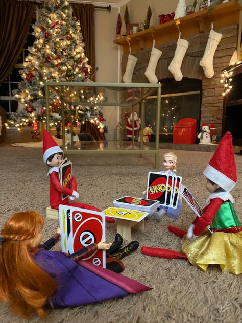 Elf On The Shelf With Toys, Elf On Shelf Playing Uno, How To Get Your Elf To Pose, Elf On The Shelf Elsa, Elf On The Shelf Frozen, Frozen Elf On The Shelf, Elf On The Shelf Lego Ideas, Bad Elf, Elf Ideas Easy