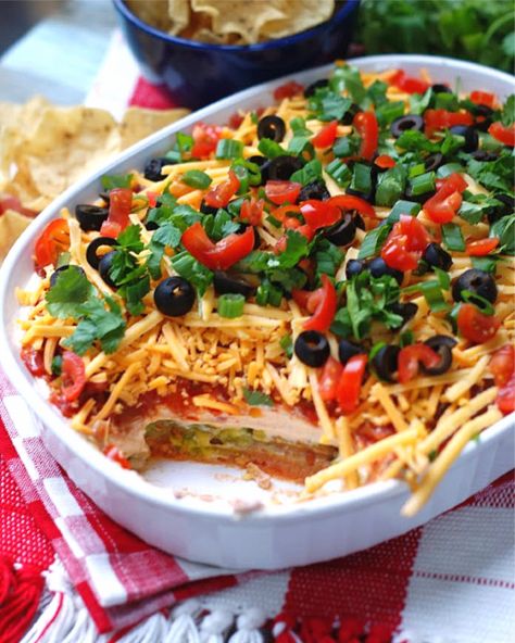 Classic Mexican 7 Layer Dip - southern discourse 7 Layered Dip, Mexican 7 Layer Dip, Appetizers Mexican, Greek Dip Recipes, Layered Dip Cups, Mexican Bean Dip, 7 Layer Bean Dip, 7 Layer Dip Recipe, Mexican Layer Dip