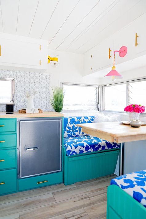 Vintage Camper Renovation, Vinyl Hardwood Flooring, Pink Cabinets, Glamper Camper, Happy Glamper, Pop Wallpaper, Vintage Camper Remodel, Retro Fridge, Cabinet Paint Colors