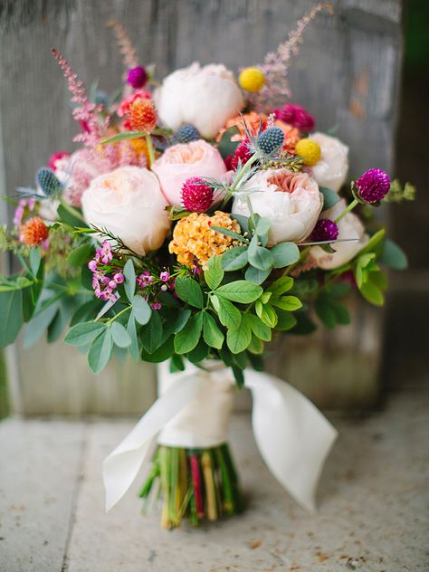 For a bright and charming wildflower wedding bouquet, accent your colorful blooms with thistle and gomphrena for combination guaranteed to catch anyone's attention. Bohemian Wedding Bouquet, Bouquet Champetre, Wildflower Wedding Bouquet, Bouquet Bride, Summer Wedding Bouquets, Wax Flowers, Fall Wedding Bouquets, Wildflower Wedding, Bouquet Of Flowers