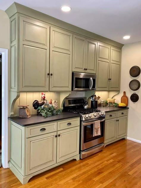 Thyme Green Paint, Brown Stone Countertops, Quaint Kitchen Ideas, Green Country Kitchen, Glazed Kitchen Cabinets, Stone Countertops Kitchen, Kitchen Cabinets Color Combination, Black Kitchen Countertops, Green Kitchen Designs