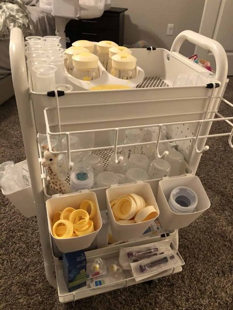 Clever Baby Bottle Organization Ideas - One Sweet Nursery Baby Bib Storage, Rolling Cart For Nursery, Baby Trolley Organiser, Rolling Cart Organization Baby, Baby Bottle Storage Kitchen, Organizing Baby Bottles In Kitchen, Breastfeeding Cart Organization, Baby Cart Organize, Newborn Rolling Cart