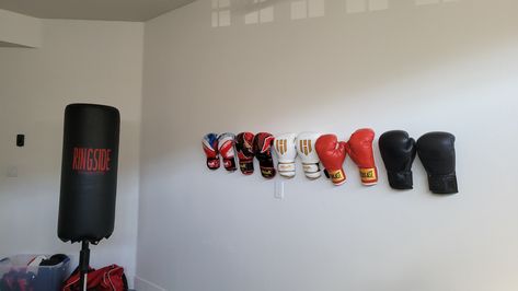 Garage boxing glove display mma ufc gym ideas hack boxer Boxing Glove Storage Ideas, Boxing Glove Display, Glove Display, Boxing Glove, Wreath Door, Boxing Gloves, Renter Friendly, Door Hangers, Door Wreaths