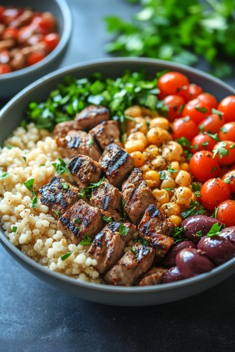 Grilled beef, couscous, cherry tomatoes, chickpeas, olives, and parsley in a bowl. Healthy Satisfying Dinners, Mediterranean Diet On The Go, Mediterranean Diet One Pan Recipes, Mediterranean Diet For Liver Health, Fresh Mediterranean Recipes, Mediterranean Recipes Steak, Hearty Salads Meals Dinners, Beginner Healthy Meals, Mediterranean Diet Easy Dinner