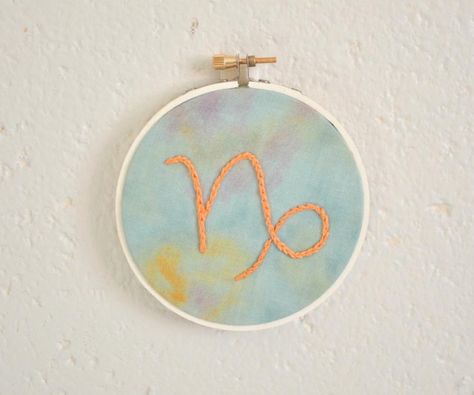 Astrology Embroidery, Embroidery Ornament, Capricorn Astrology, Embroidery Ornaments, Tussar Saree, Capricorn Sign, Sun Sign, Personalized Ornaments, Embroidery And Stitching