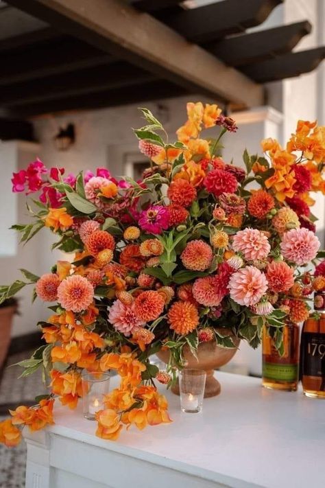 Fiesta Wedding Flowers, Wedding Centerpieces For Circle Tables, Orange Flower Decorations, Spanish Floral Arrangements, Bougainvillea Floral Arrangement, Orange Orchid Bouquet, Fruit And Floral Arrangements, Red Spring Flowers, Strawflower Arrangement